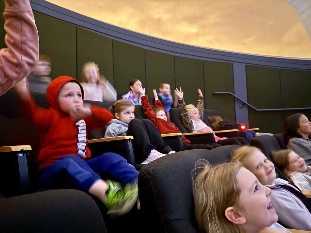 Otselic Valley first grade students explore exhibits, participate in hands-on activities, and learn during a field trip to the Colgate Science Center, planetarium, and geology museum.