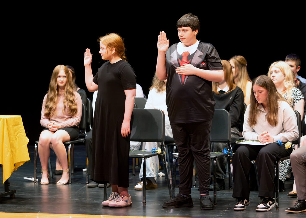 Two students take the Jr. NHS pledge