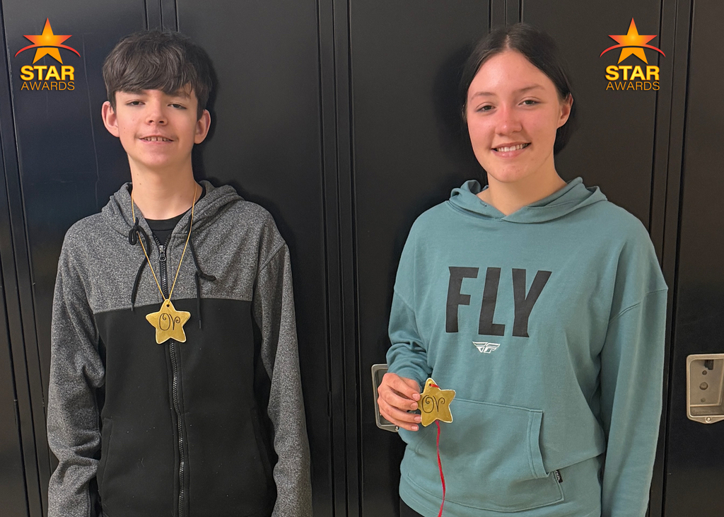 Students pose for a photo after being recognized as Otselic Valley Star Award recipients for demonstrating cooperation.
