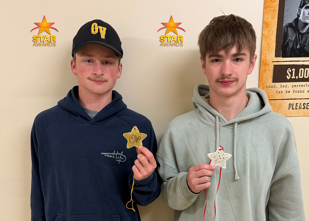 Students pose for a photo after being recognized as Otselic Valley Star Award recipients for demonstrating cooperation.