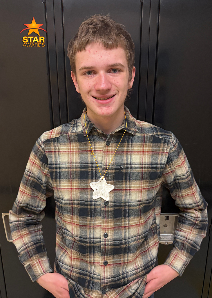 Student poses for a photo after being recognized as Otselic Valley Star Award recipients for demonstrating cooperation.