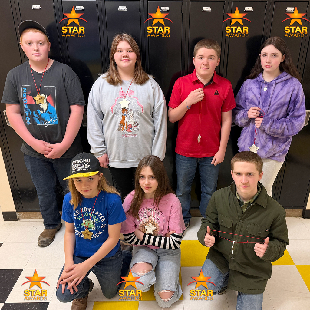 Students pose for a photo after being recognized as Otselic Valley Star Award recipients for demonstrating cooperation.