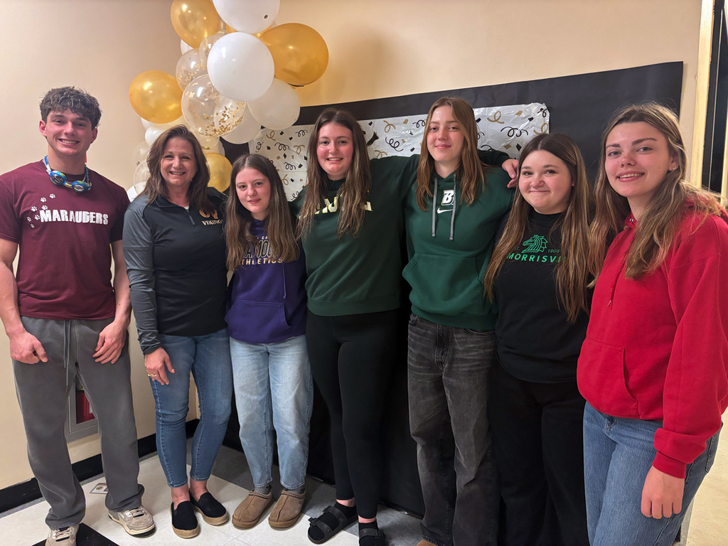 OV seniors gather for a Decision Day celebration, posing for group photos with classmates.