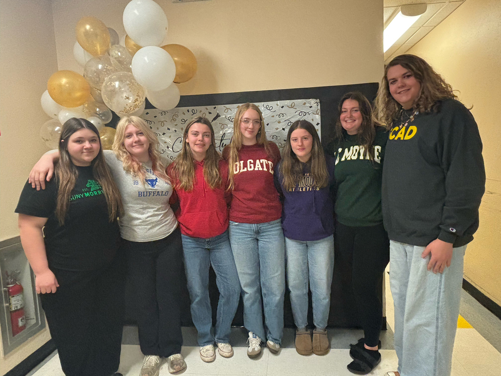 OV seniors gather for a Decision Day celebration, posing for group photos with classmates.
