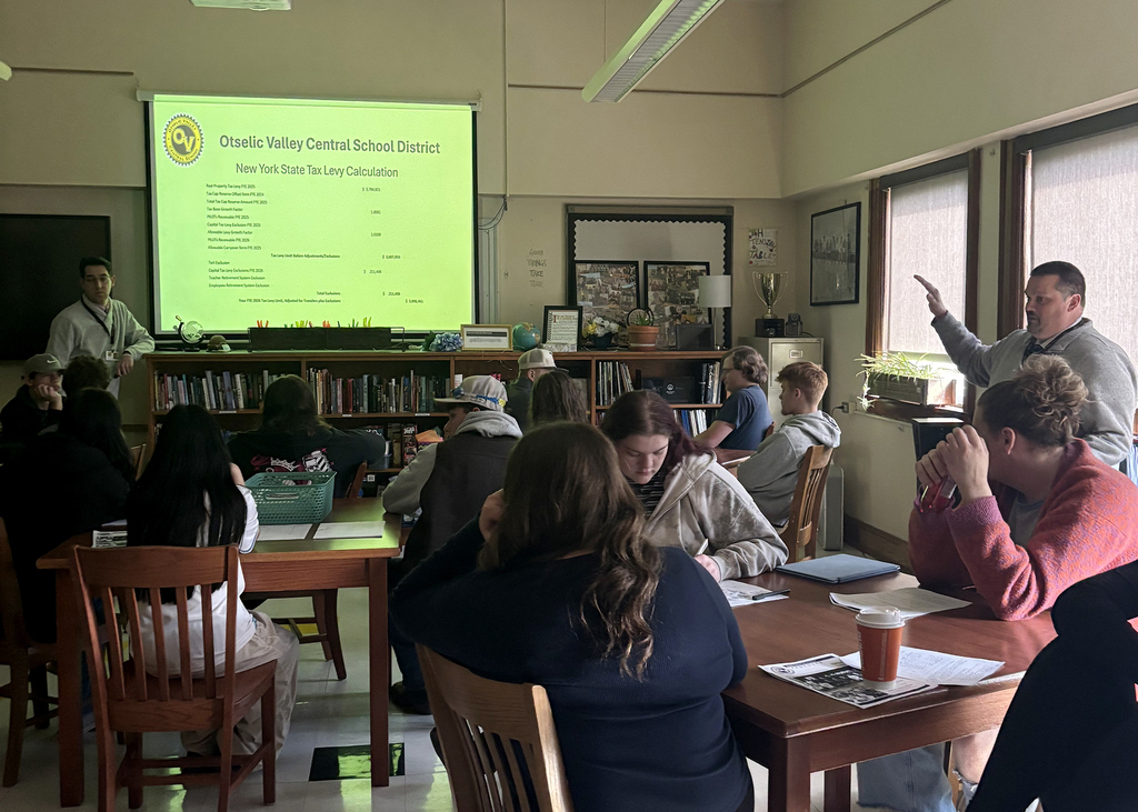 Students in Mrs. Osowski’s economics class listen as district administrators answer questions about the proposed school budget during a classroom discussion at Otselic Valley.