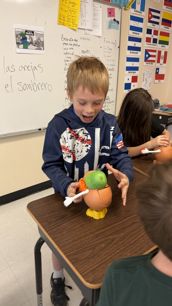 Third grade students participate in interactive Spanish language activities, including games and hands-on learning focused on body parts vocabulary.