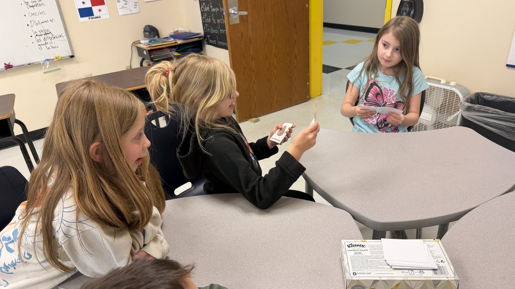 Third grade students participate in interactive Spanish language activities, including games and hands-on learning focused on body parts vocabulary.