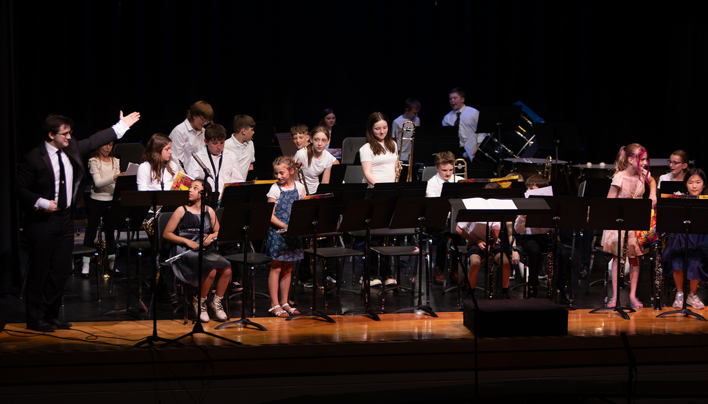 Photos from the Otselic Valley Spring Band and Chorus Concert featuring student musicians and vocalists performing on stage.
