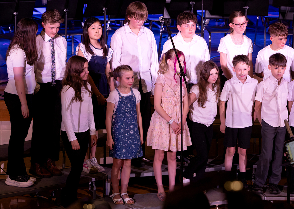 Photos from the Otselic Valley Spring Band and Chorus Concert featuring student musicians and vocalists performing on stage.