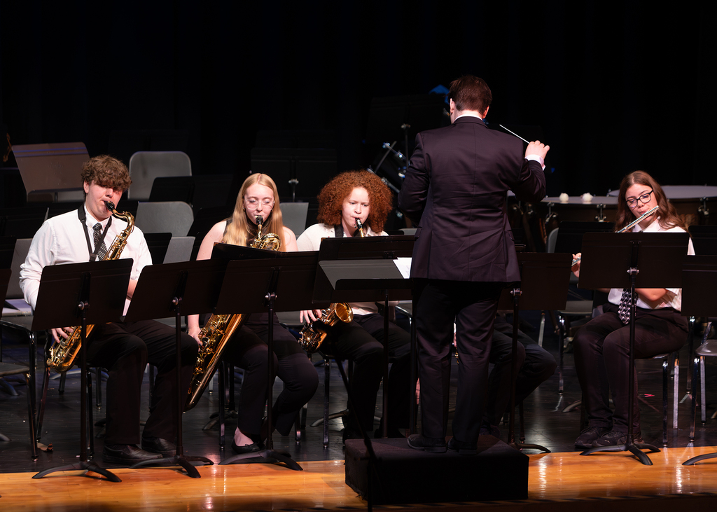 Photos from the Otselic Valley Spring Band and Chorus Concert featuring student musicians and vocalists performing on stage.