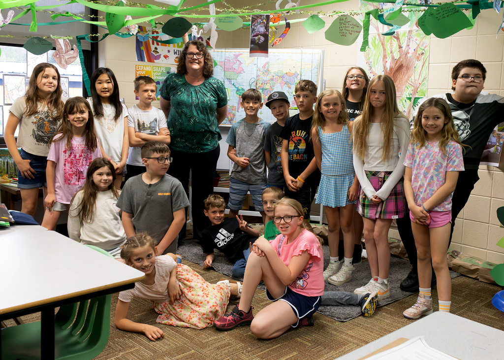Photos from the “Welcome to the Jungle” rainforest classroom tour featuring student-created displays, artwork, and interactive learning experiences.
