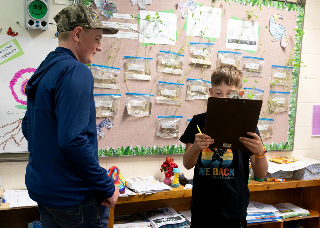 Photos from the “Welcome to the Jungle” rainforest classroom tour featuring student-created displays, artwork, and interactive learning experiences.