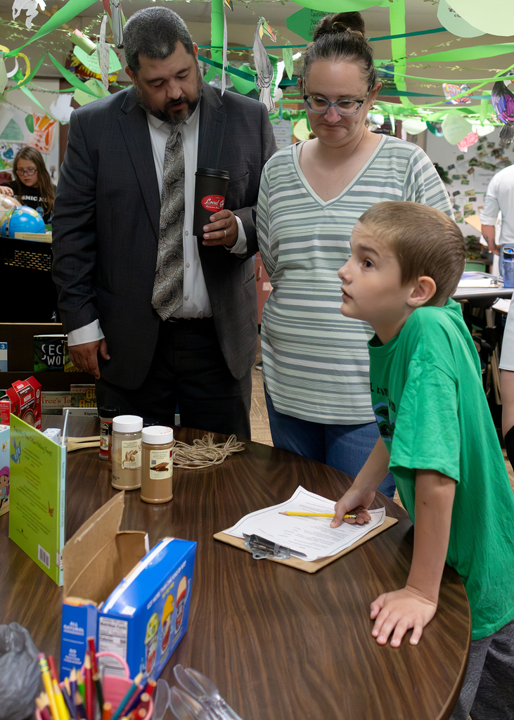 Photos from the “Welcome to the Jungle” rainforest classroom tour featuring student-created displays, artwork, and interactive learning experiences.