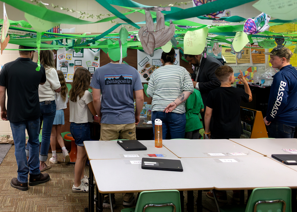 Photos from the “Welcome to the Jungle” rainforest classroom tour featuring student-created displays, artwork, and interactive learning experiences.