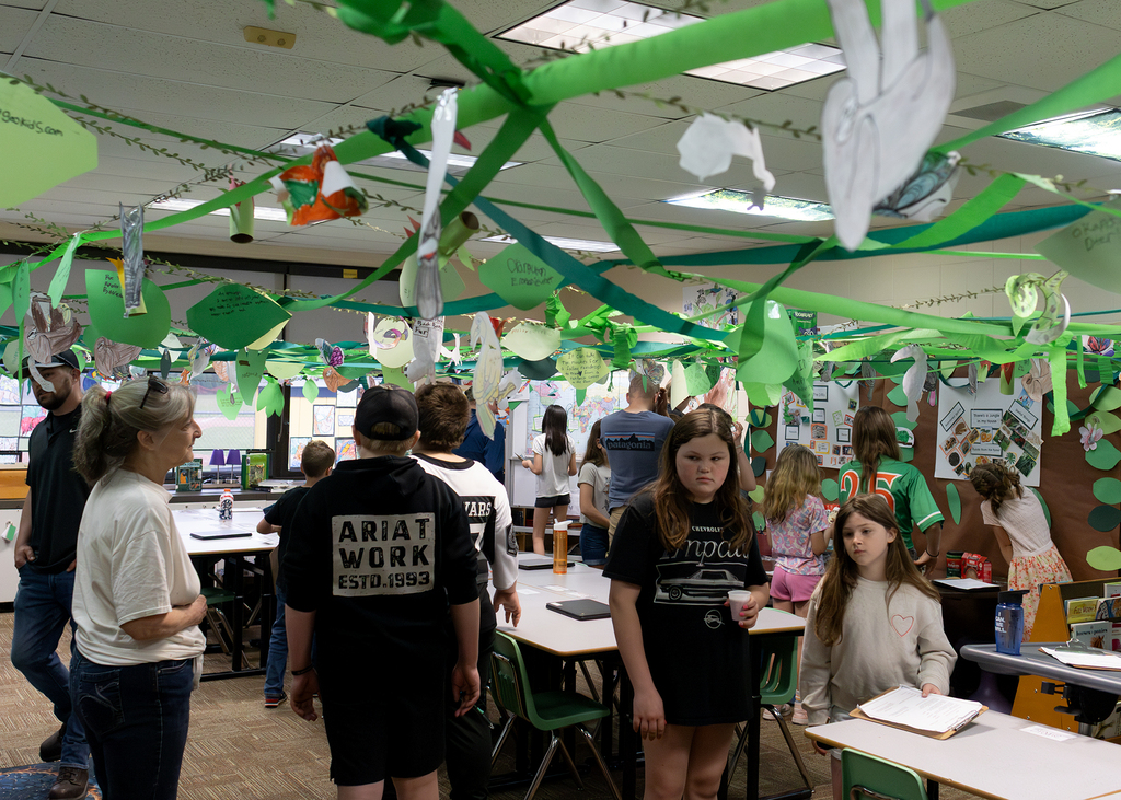 Photos from the “Welcome to the Jungle” rainforest classroom tour featuring student-created displays, artwork, and interactive learning experiences.