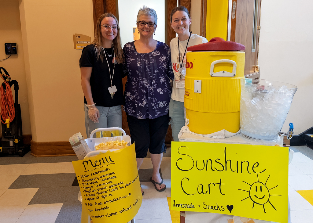 Ms. Macrino, Ms. Cruikshank and Mrs. Hicks posing with the Sunshine Cart