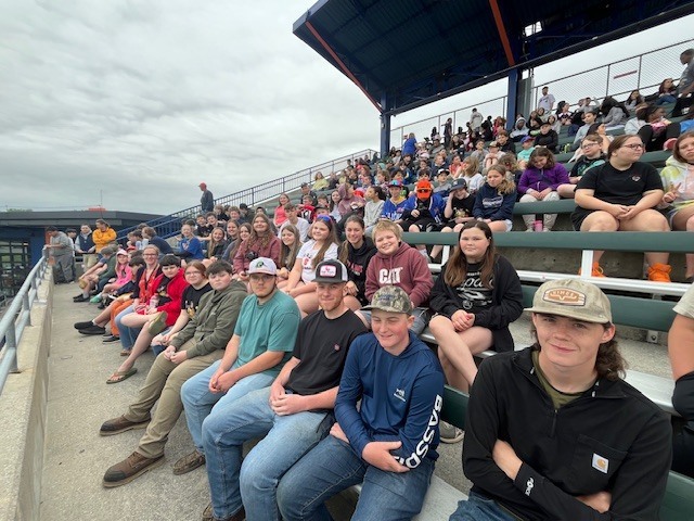 Students and staff attending a Syracuse Mets game during an OV incentive trip. Photos show students at the ballpark, in the stands, and enjoying the day together.
