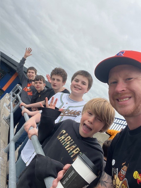 Students and staff attending a Syracuse Mets game during an OV incentive trip. Photos show students at the ballpark, in the stands, and enjoying the day together.