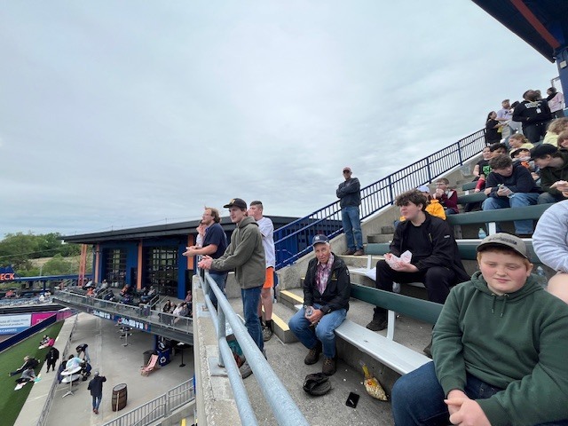 Students and staff attending a Syracuse Mets game during an OV incentive trip. Photos show students at the ballpark, in the stands, and enjoying the day together.