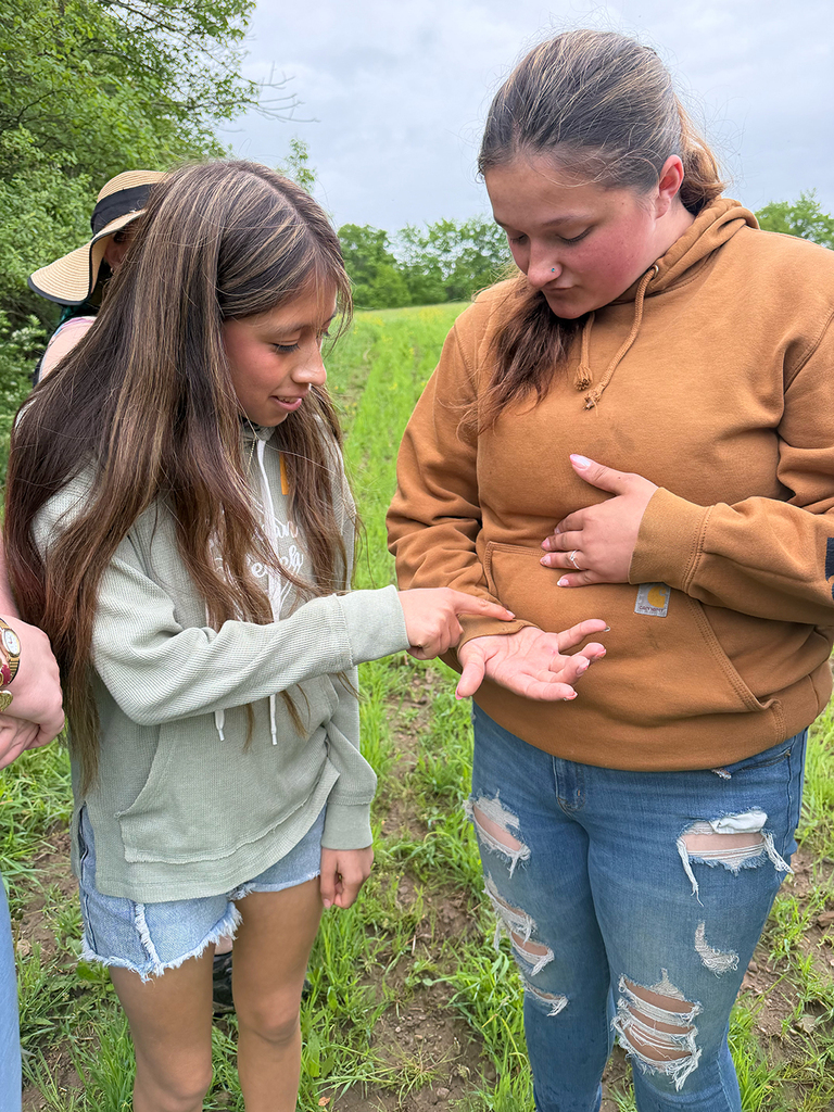 Students explore outdoor art installations and hiking trails during a field trip to Stone Quarry Art Park in Cazenovia. Photos show students enjoying nature, viewing artwork, and spending time outdoors with classmates.