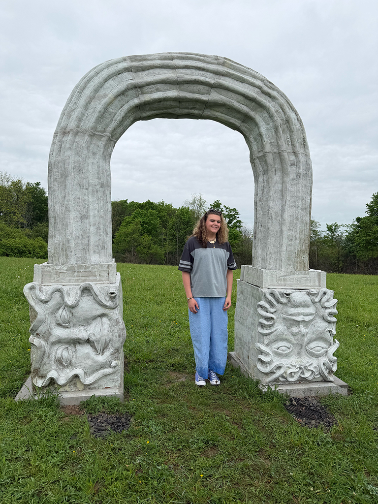 Students explore outdoor art installations and hiking trails during a field trip to Stone Quarry Art Park in Cazenovia. Photos show students enjoying nature, viewing artwork, and spending time outdoors with classmates.