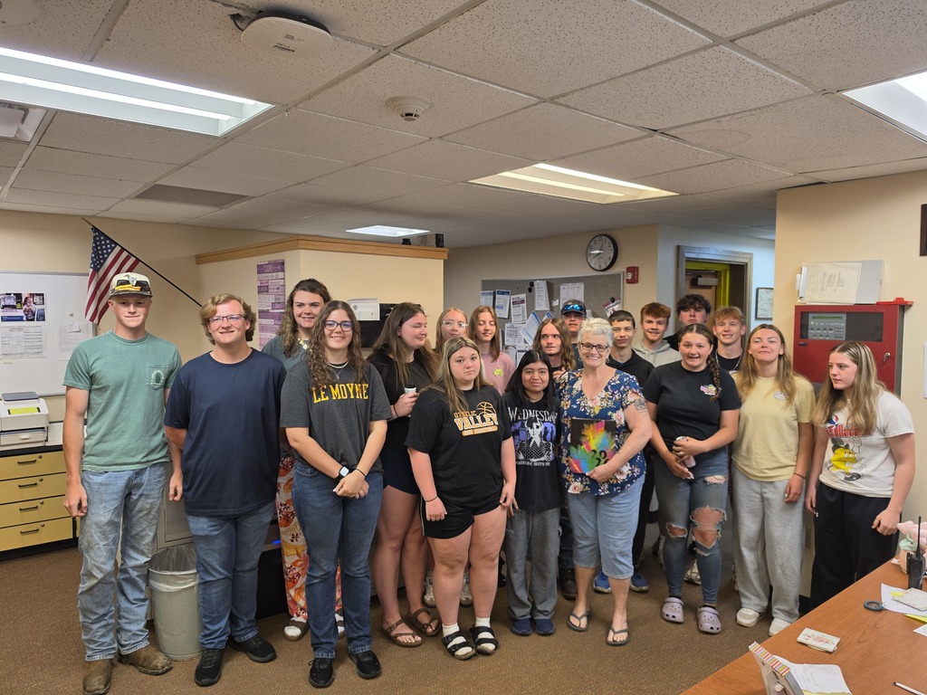 Photos of Mrs. Tina Cruikshank and Otselic Valley students recognizing her as the recipient of the Class of 2026 yearbook dedication.