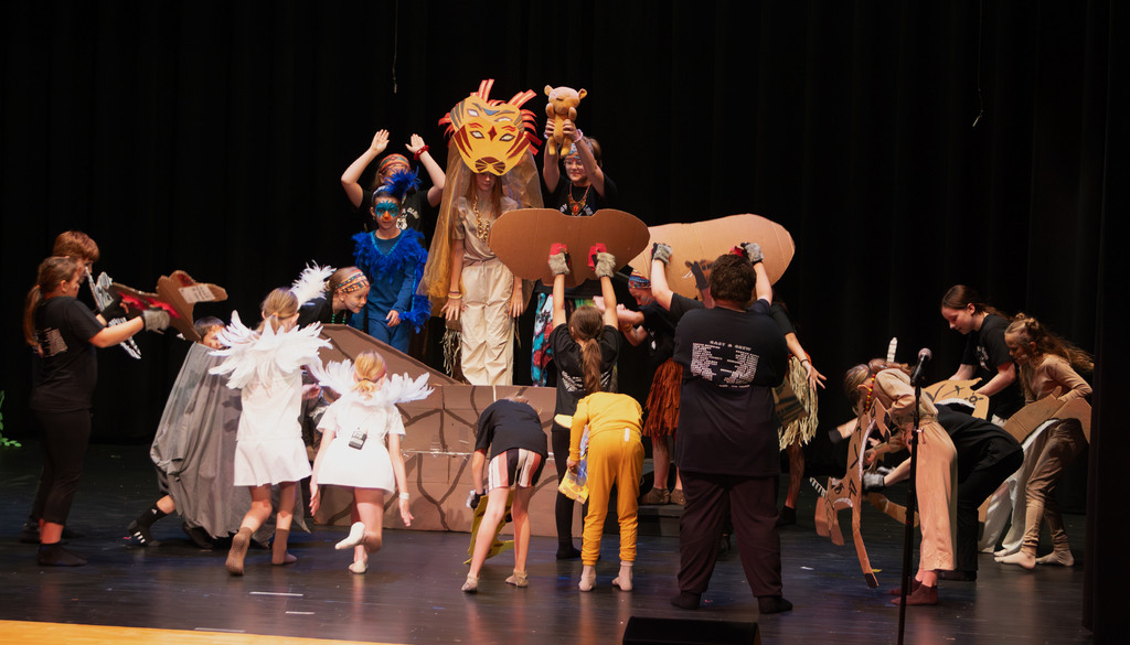 Students perform scenes from Disney's The Lion King KIDS during a dress rehearsal at Otselic Valley. The photos show cast members in costume and on stage as they bring the story of Simba and the Pride Lands to life.
