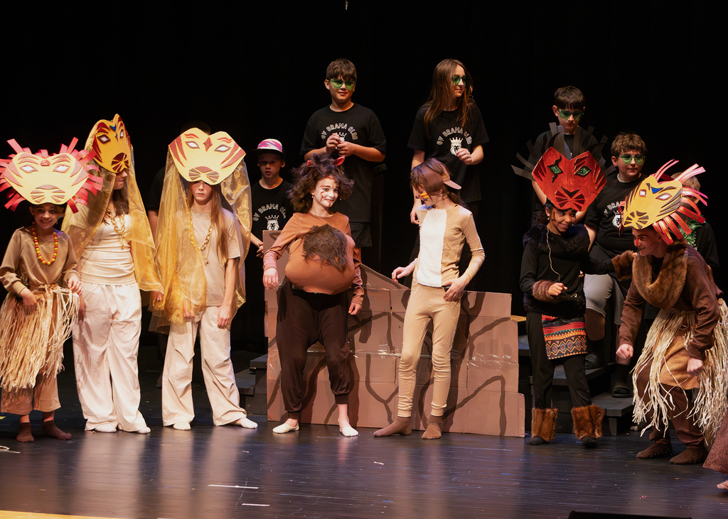 Students perform scenes from Disney's The Lion King KIDS during a dress rehearsal at Otselic Valley. The photos show cast members in costume and on stage as they bring the story of Simba and the Pride Lands to life.