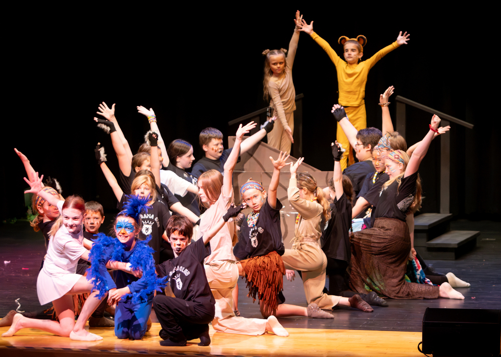 Students perform scenes from Disney's The Lion King KIDS during a dress rehearsal at Otselic Valley. The photos show cast members in costume and on stage as they bring the story of Simba and the Pride Lands to life.
