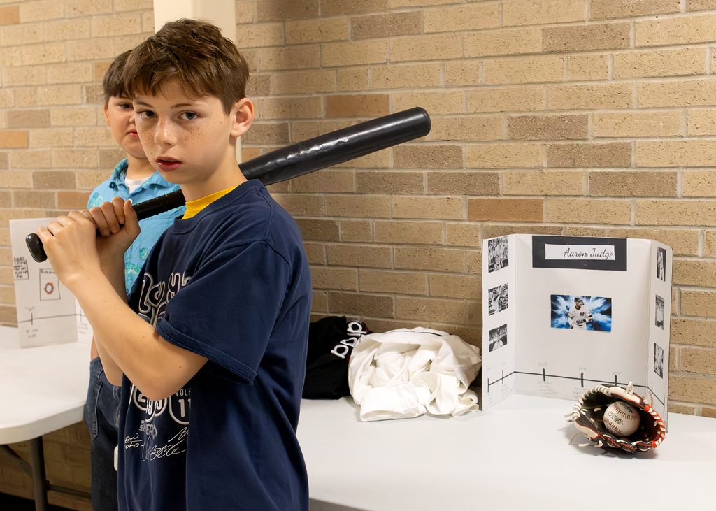 Fourth and fifth grade students participate in a Wax Museum project at Otselic Valley. Students dress as historical figures and notable individuals while presenting information and answering questions from visitors who toured the exhibits.