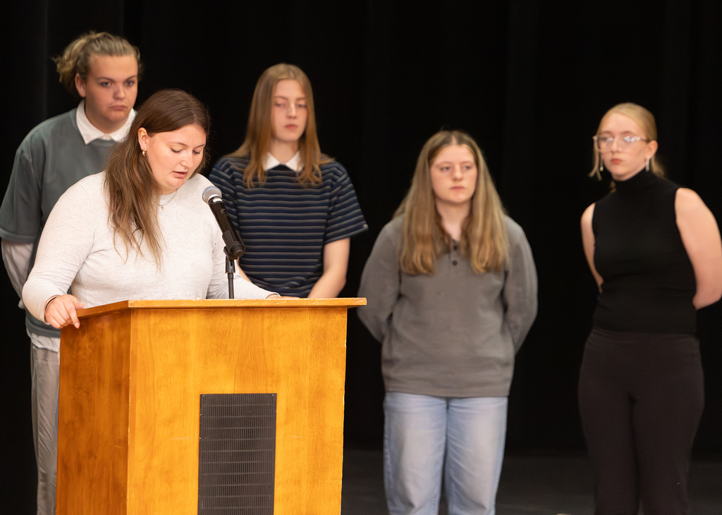 Otselic Valley seniors present their Civic Action Projects during the Voices for Change event. Students speak to an audience while sharing research, community concerns, and action plans developed throughout the school year.