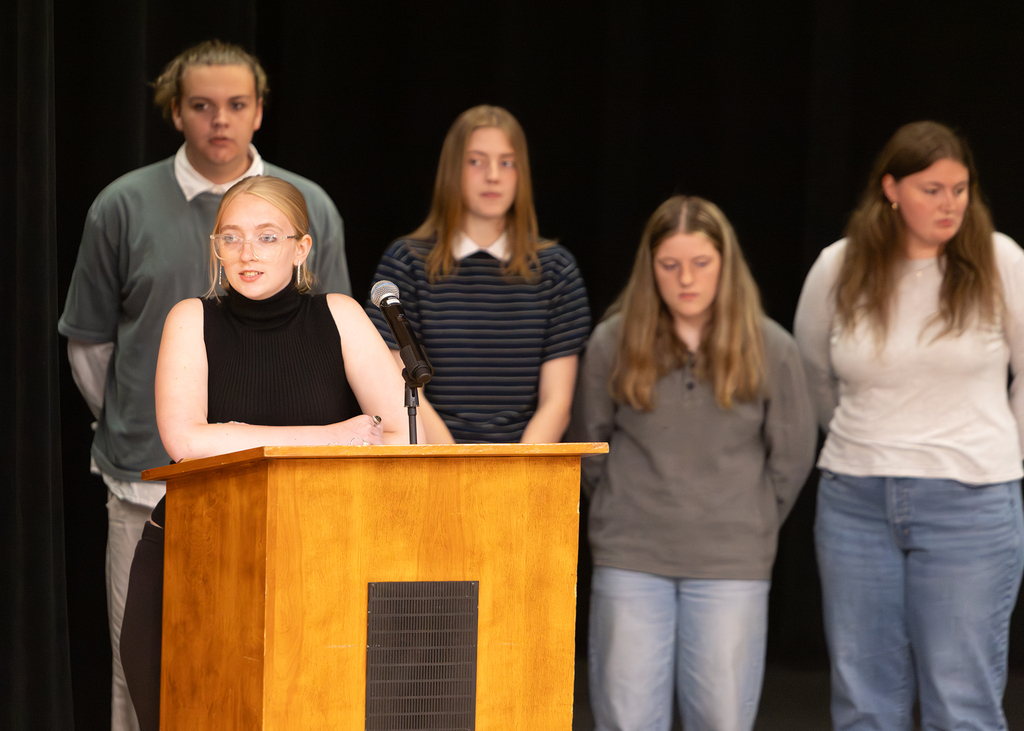 Otselic Valley seniors present their Civic Action Projects during the Voices for Change event. Students speak to an audience while sharing research, community concerns, and action plans developed throughout the school year.