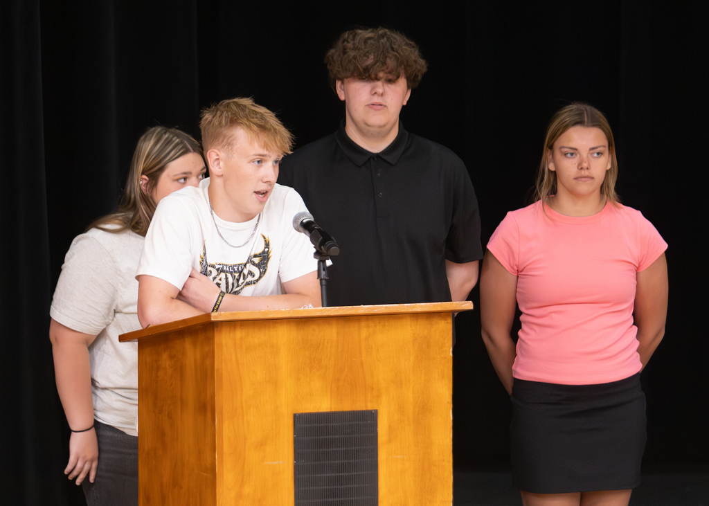 Otselic Valley seniors present their Civic Action Projects during the Voices for Change event. Students speak to an audience while sharing research, community concerns, and action plans developed throughout the school year.
