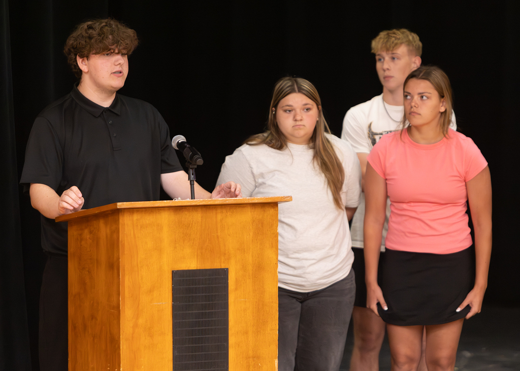 Otselic Valley seniors present their Civic Action Projects during the Voices for Change event. Students speak to an audience while sharing research, community concerns, and action plans developed throughout the school year.