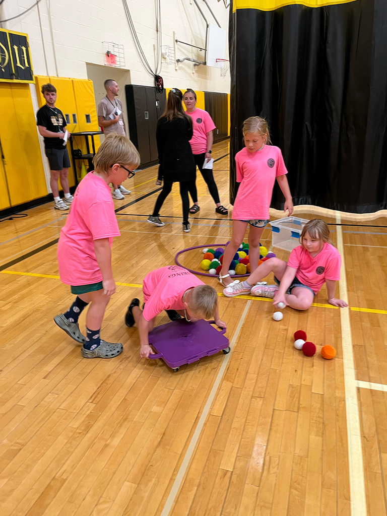 Elementary students enjoy Field Day activities and games with classmates.