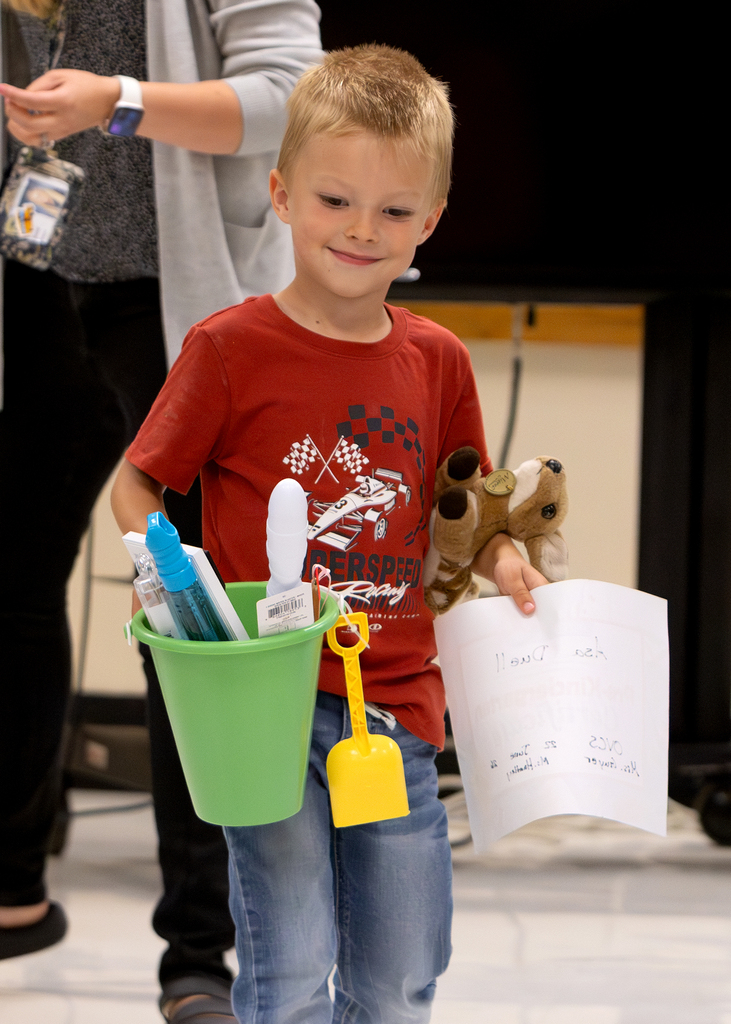 Pre-K students participate in an end-of-year celebration with staff and families.