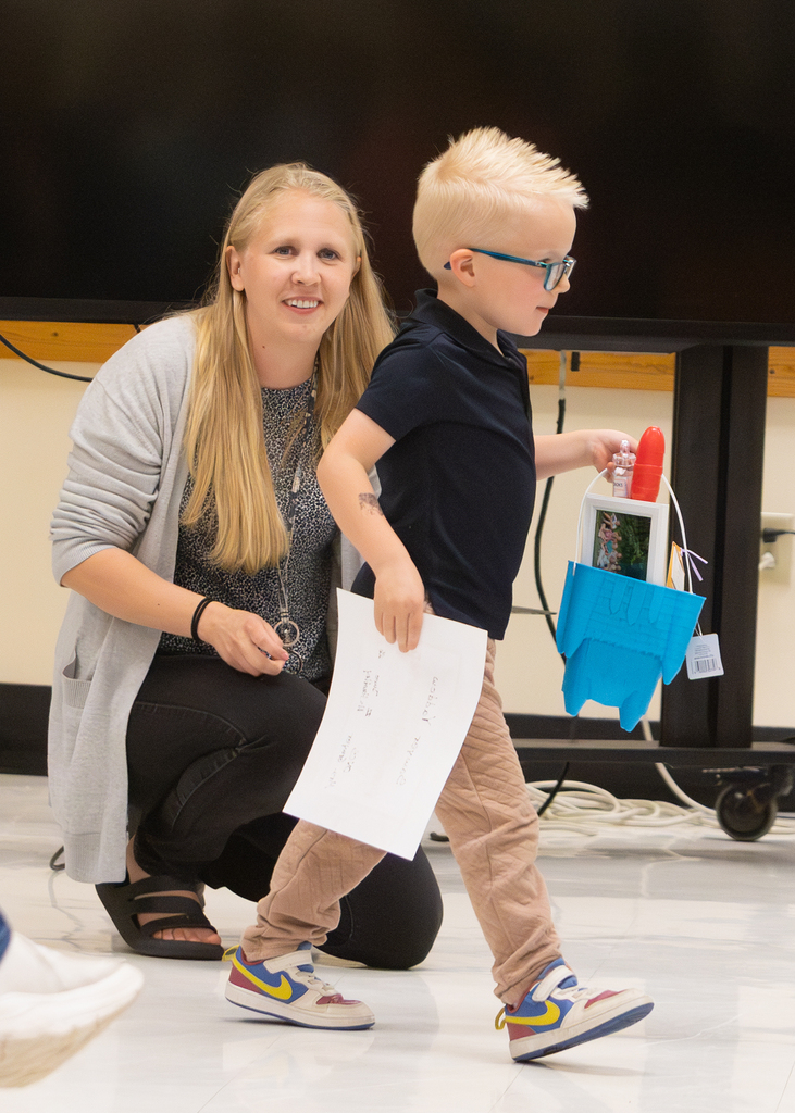 Pre-K students participate in an end-of-year celebration with staff and families.