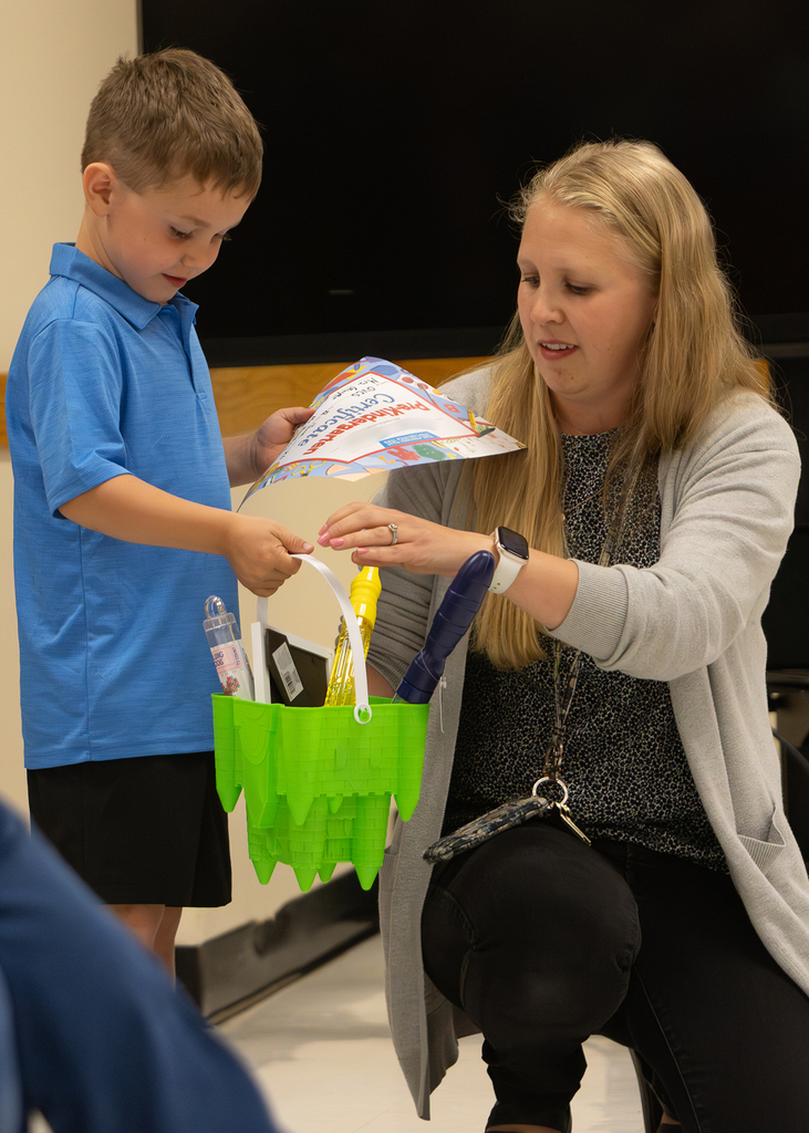 Pre-K students participate in an end-of-year celebration with staff and families.