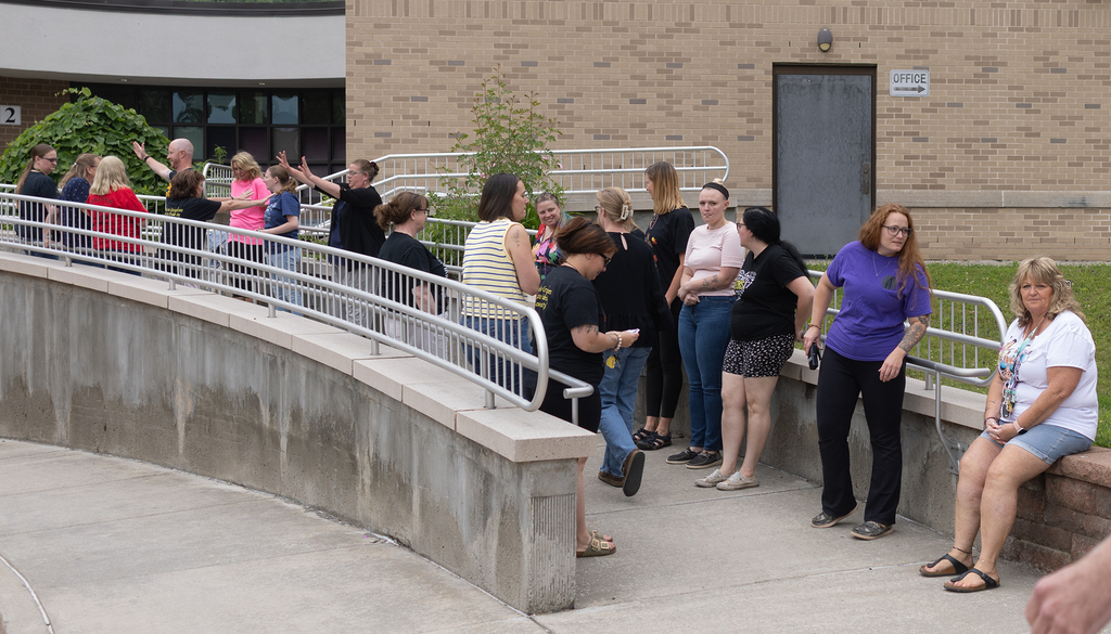 Staff lines up for the final day of students