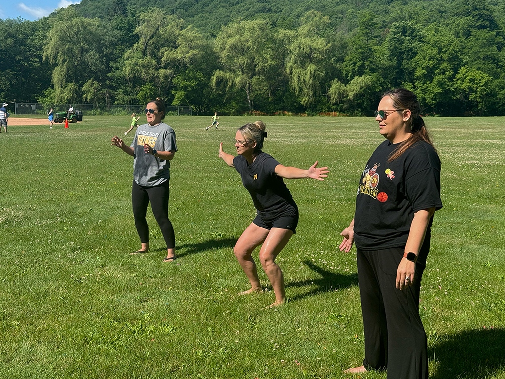 Elementary students enjoy Water Day outdoors, celebrating the end of the school year with fun activities and water balloons.