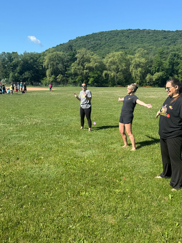 Elementary students enjoy Water Day outdoors, celebrating the end of the school year with fun activities and water balloons.