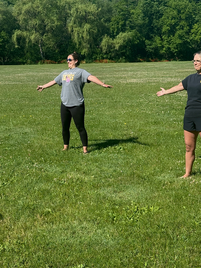 Elementary students enjoy Water Day outdoors, celebrating the end of the school year with fun activities and water balloons.
