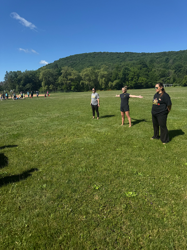 Elementary students enjoy Water Day outdoors, celebrating the end of the school year with fun activities and water balloons.