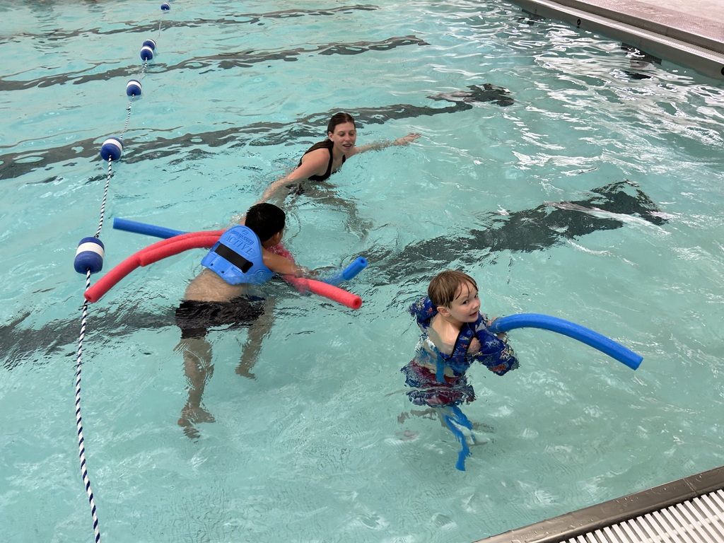 Students swim in the Sherbune Earlville pool.