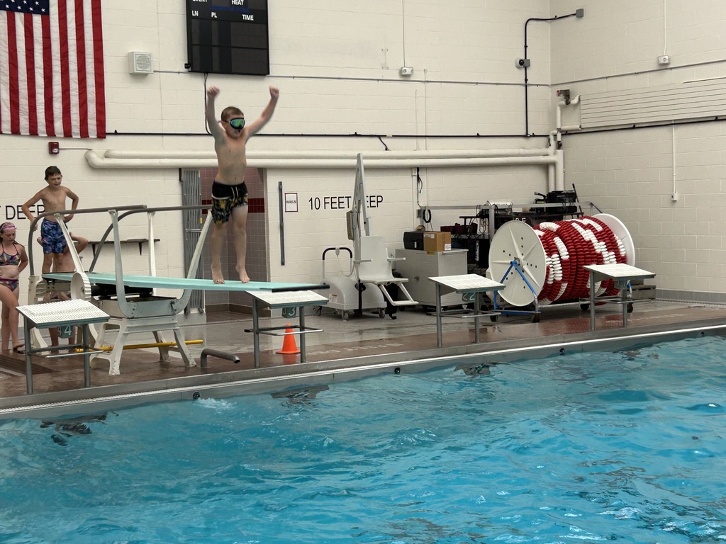 A student on a diving board.