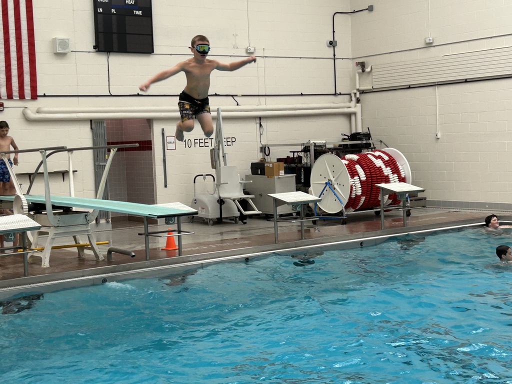 A student jumps into the Sherburne-Earlville pool.