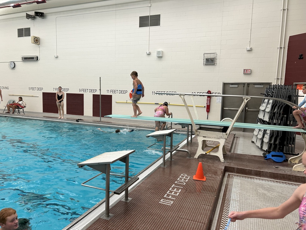 A student on a diving board.