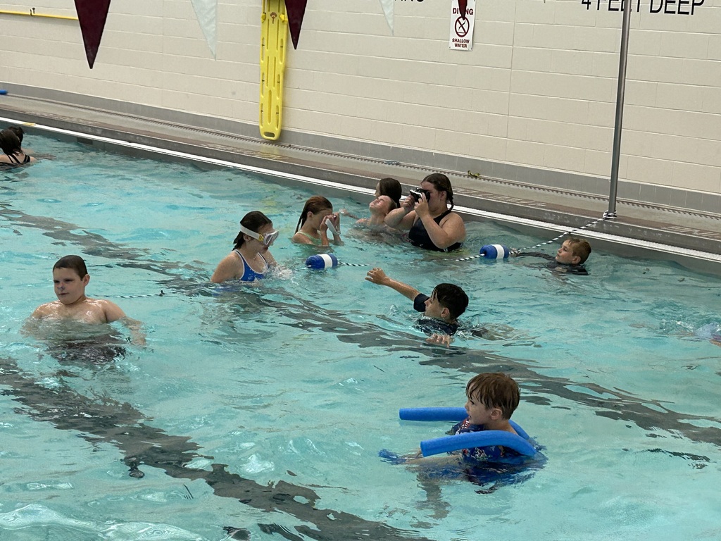Students swim in the Sherbune Earlville pool.