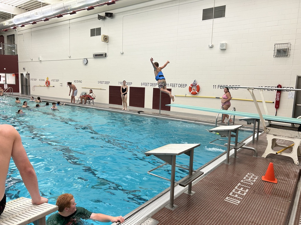 A student jumping off a diving board.