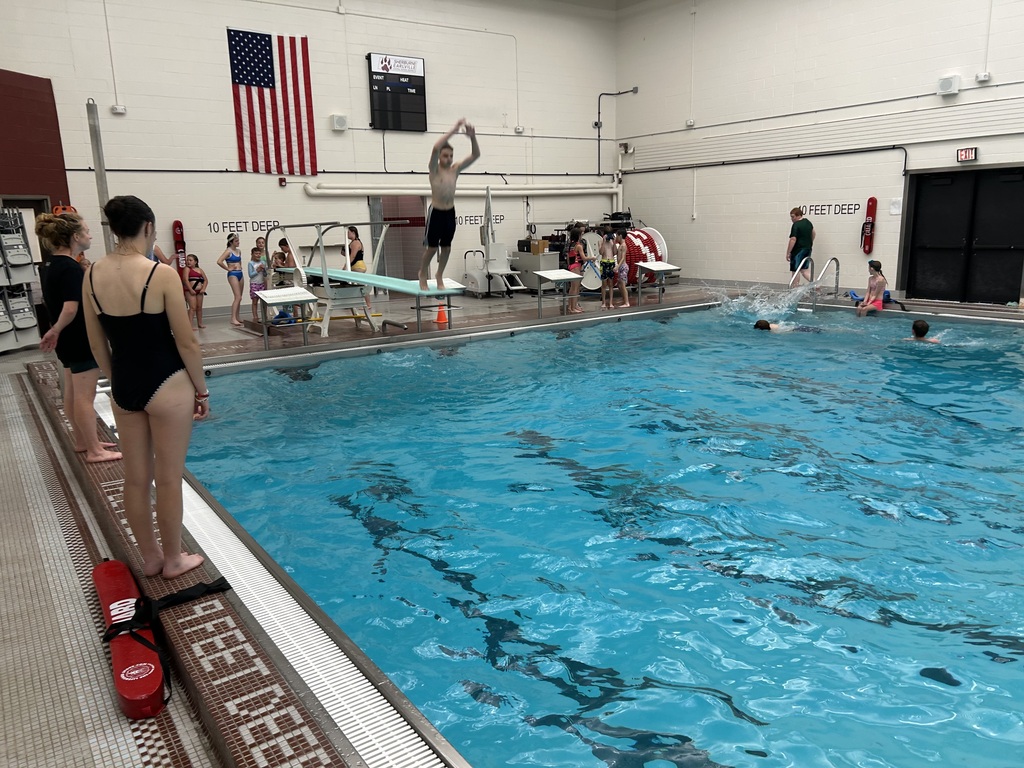 A student on a diving board.